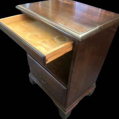 Sale Photo Thumbnail #949: 27.00 x 19 x 14.50 Solid wood end table/nightstand in warm mahogany finish featuring top slide-out tray  open middle display cubby section  lower drawer with brass bail handle  and bracket feet. 27.00 x 19 x 14.50  