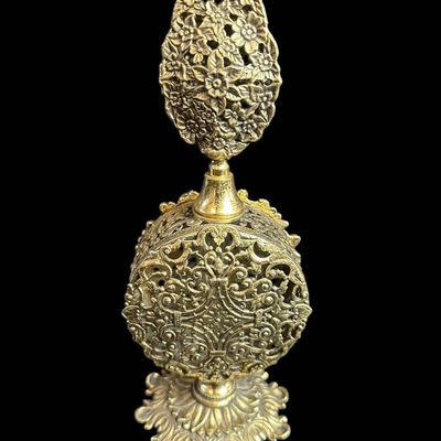 Sale Photo Thumbnail #954:  Ornate Filigree Gold-Tone Perfume Flask With Floral Motif  8.25 Inches Tall.                           