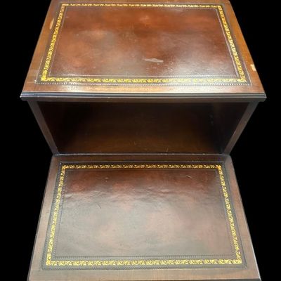 Sale Photo Thumbnail #958: 25.50 x 17.75 x 29.00 Traditional two-tier step-down end table featuring gold-embossed leather top surfaces  open middle cubby bay  lower drawer with brass swan-neck pull handle  and dovetail joinery 25.50 x 17.75 x 29.00  
