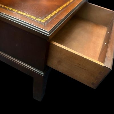 Sale Photo Thumbnail #957: 25.50 x 17.75 x 29.00 Traditional two-tier step-down end table featuring gold-embossed leather top surfaces  open middle cubby bay  lower drawer with brass swan-neck pull handle  and dovetail joinery 25.50 x 17.75 x 29.00  