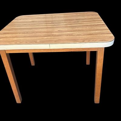 Sale Photo Thumbnail #968: 36"L × 28"D × 28.5"T Small retro feel dining/utility table featuring faux wood grain laminate top with white trim edge and solid wood square legs. Dimensions: 28.50" Tall x 36" Long x 28" Deep.  