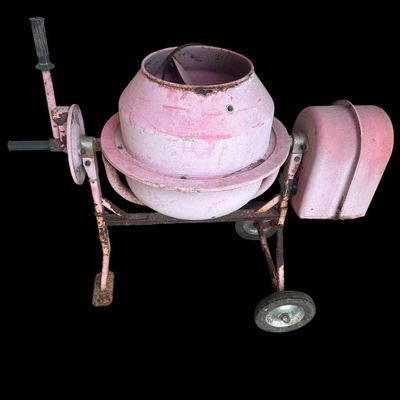 Sale Photo Thumbnail #983: Heavy-duty electric-powered portable concrete mixer on a two-wheeled steel cart frame  custom painted pink with hand dump wheel lever.  