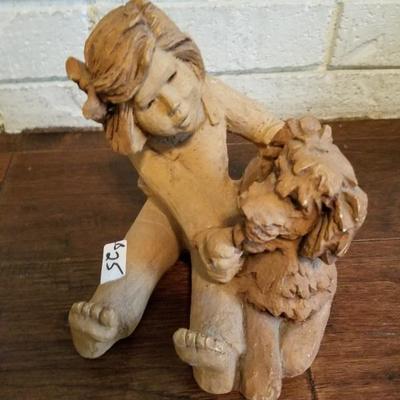 Girl Holding Dog Clay Sculpture 