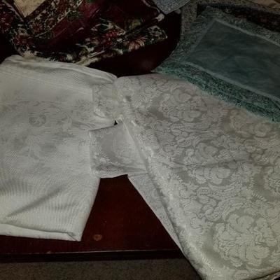 Collection of vintage table clothes and napkin sets