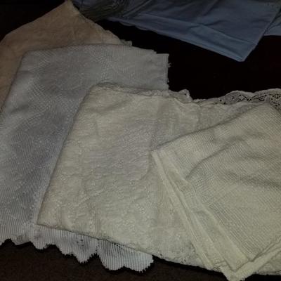 Collection of vintage table clothes and napkin sets