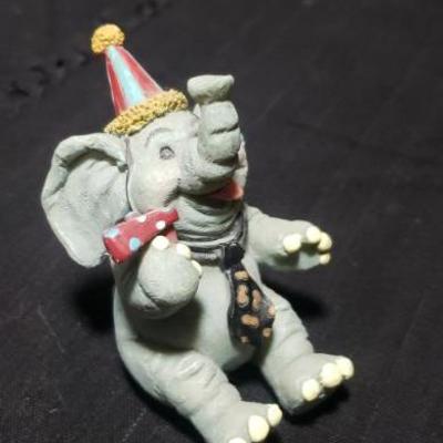 Birthday Elephant sits on ledge