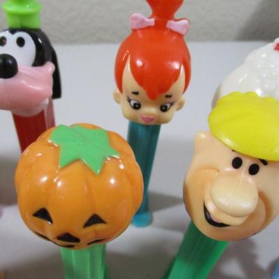 Large Lot of Pez  and rubber Flintstones Chracters 
