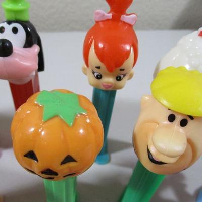 Large Lot of Pez  and rubber Flintstones Chracters 