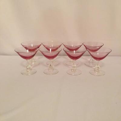 Lot 44 - Pink Stemware & Plates