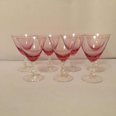 Lot 44 - Pink Stemware & Plates
