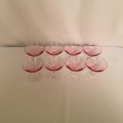 Lot 44 - Pink Stemware & Plates