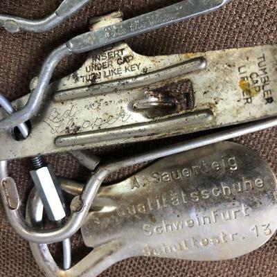 Lot #11  Ring with antique can and bottle Openers