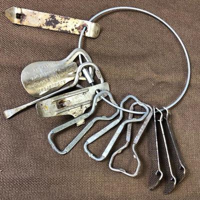 Lot #11  Ring with antique can and bottle Openers