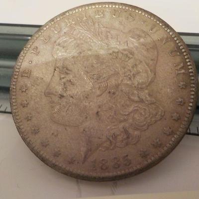 1885 Morgan silver dollar.