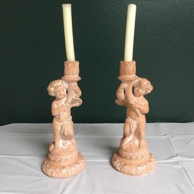 F-103 Pair of cherub terra-cotta candlesticks