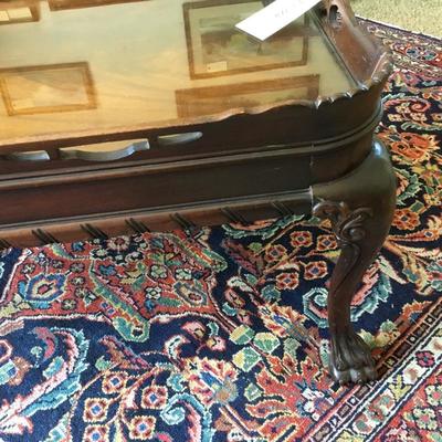 L-118 antique pie crust style coffee table, clawfoot and heavily carved