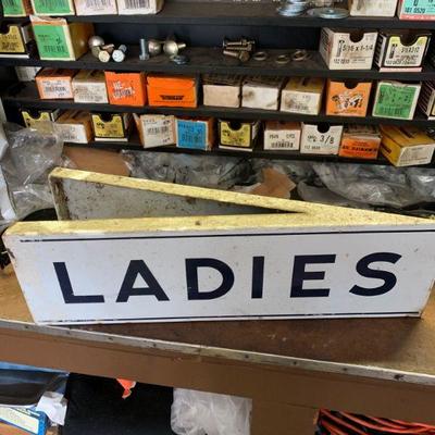 Vintage enamel men / woman restroom signs 