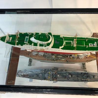 4 completed ship models inside of a customized aquarium 