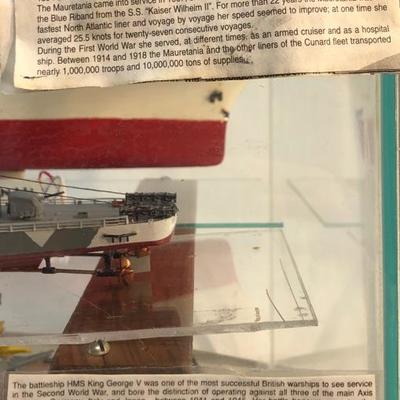 4 completed ship models inside of a customized aquarium 