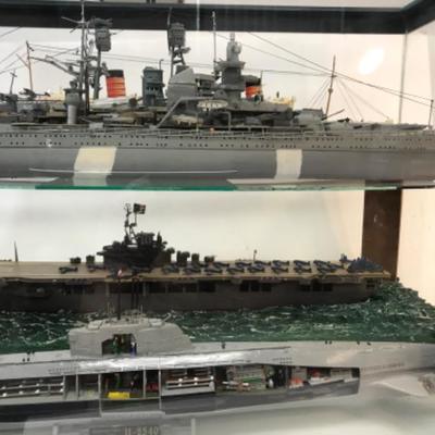 5 Completed ship models inside homemade display case