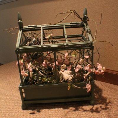 LOT #282: Large Home deco Bird Cage w/ artificial floral arrangement inside.