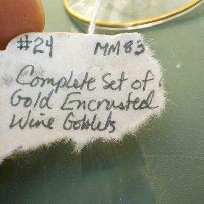 6 Elegant Crystal with gold engraved wine gobbets . 