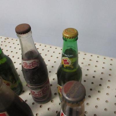 Lot 12 - Soda Bottles - Coke Pepsi Sun Drop 7up