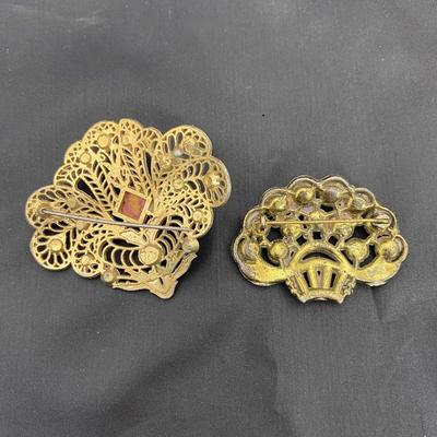 .50. Celluloid & Brooch Lot