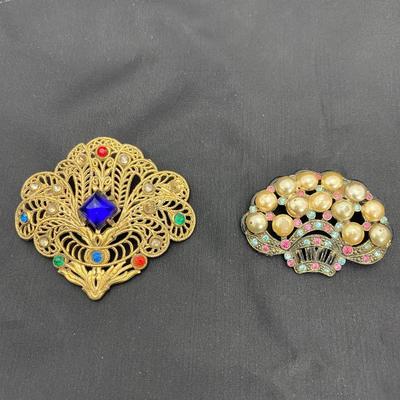 .50. Celluloid & Brooch Lot
