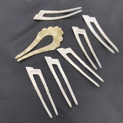 .50. Celluloid & Brooch Lot