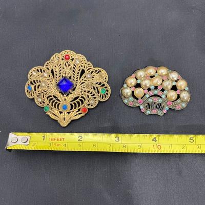 .50. Celluloid & Brooch Lot