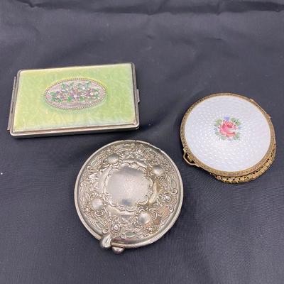 .57. Three Vintage Compacts