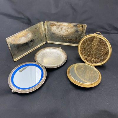 .57. Three Vintage Compacts