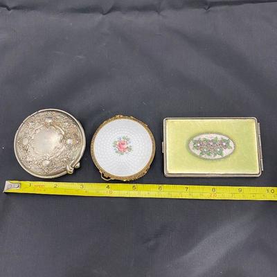 .57. Three Vintage Compacts