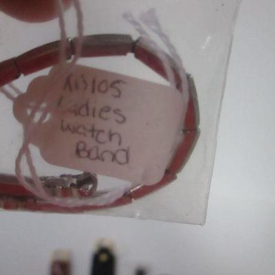 Lot 106 - Key Chains & Watches & Bands