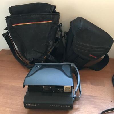 398:  Minolta Yashica and Polaroid Cameras with Accessories 