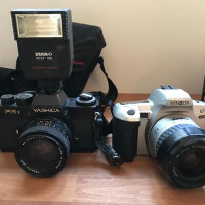398:  Minolta Yashica and Polaroid Cameras with Accessories 