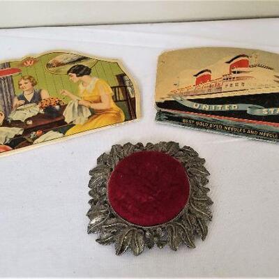 Lot #93  Pair of vintage needle cases and a vintage pincushion