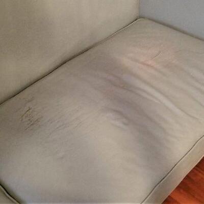 Lot #141  Teal Leather Sofa - some damage
