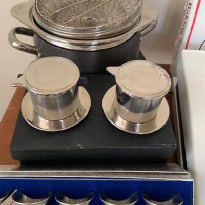 8. Assorted kitchenware (bowls, cutting boards, pizza stone, pewter, thermometer, crock pot, etc.)