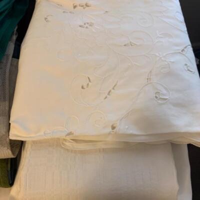 15. Large collection (18 pieces) of table linens (up to 108â€ in length) in assorted colors and fabrics