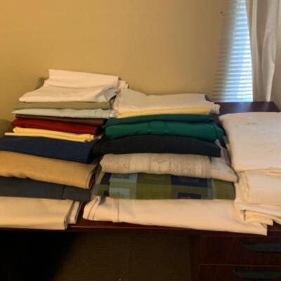 15. Large collection (18 pieces) of table linens (up to 108â€ in length) in assorted colors and fabrics