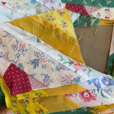 Quilters lot including pieced squares ruler safety pins and precut pieces