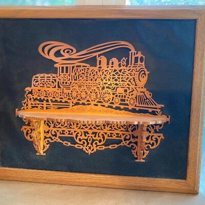 Scroll carved wood train  art with shelf