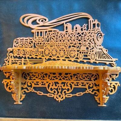 Scroll carved wood train  art with shelf