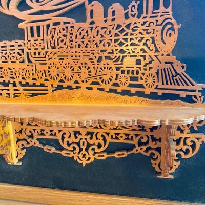 Scroll carved wood train  art with shelf