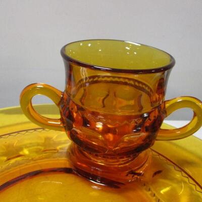 Lot 53 - Amber Depression Fostoria Glass Plates With Matching Cups 