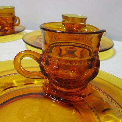 Lot 53 - Amber Depression Fostoria Glass Plates With Matching Cups 