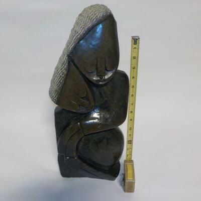 African carved serpentine stone sculpture of two people. Signed â€œH. Ncubeâ€  Likely from Zimbabwe.