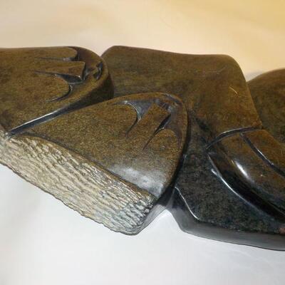African carved serpentine stone sculpture of two people. Signed â€œH. Ncubeâ€  Likely from Zimbabwe.